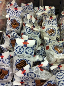 A pile of bags of stroopwaffels at the grocery store.